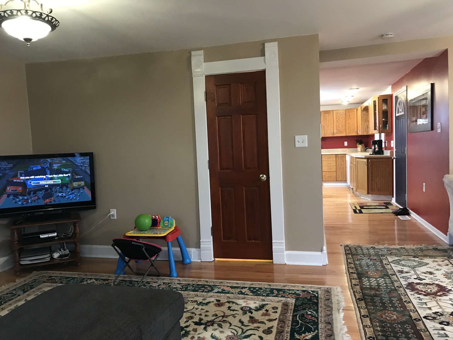 24562 Esmond Road Malta, IL 60150 - Photo 5 of 29 a living room with furniture and a flat screen tv