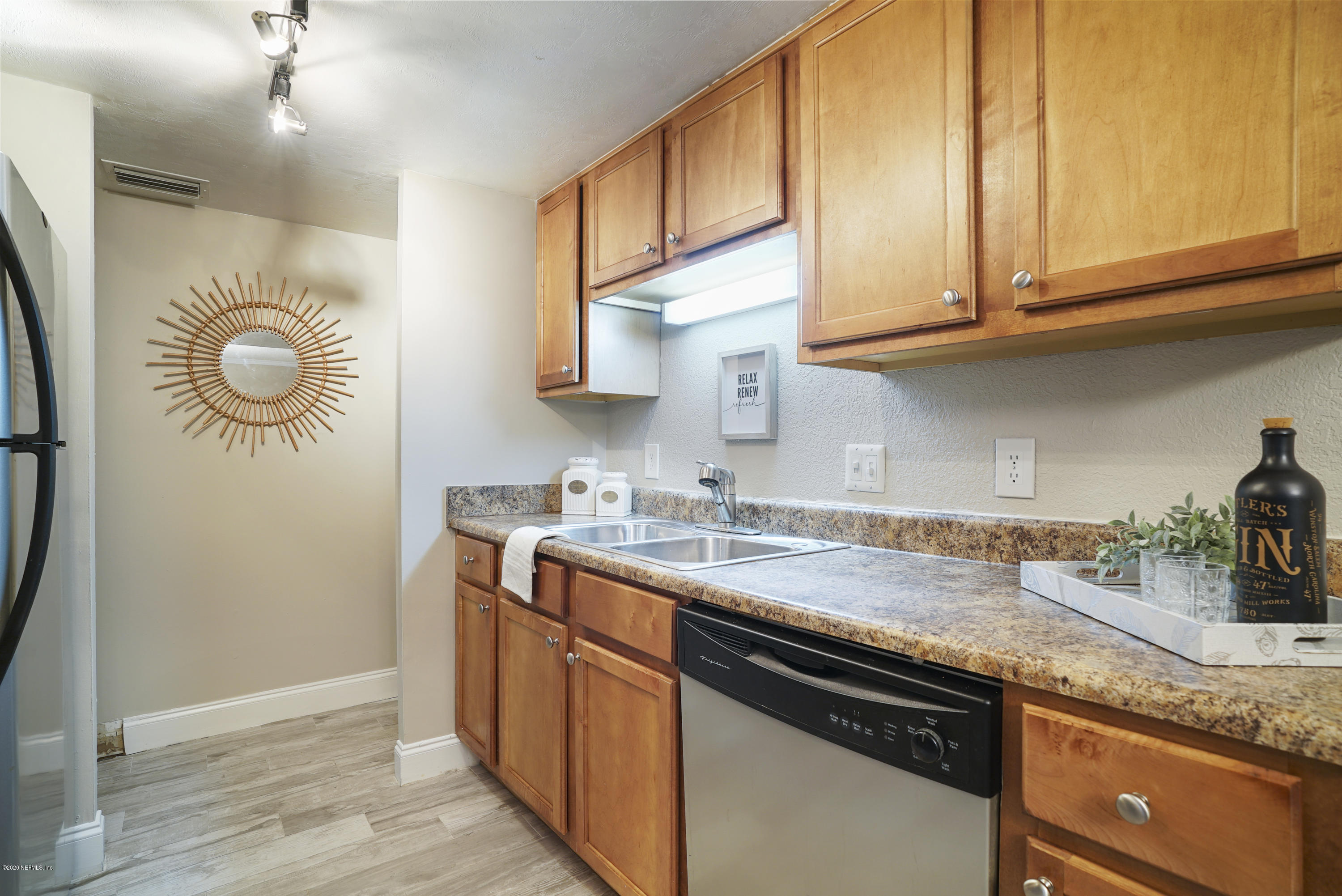 3737 Loretto Road, Unit 708 Jacksonville, FL 32223 - Photo 11 of 19 a kitchen with stainless steel appliances granite countertop a sink stove and cabinets