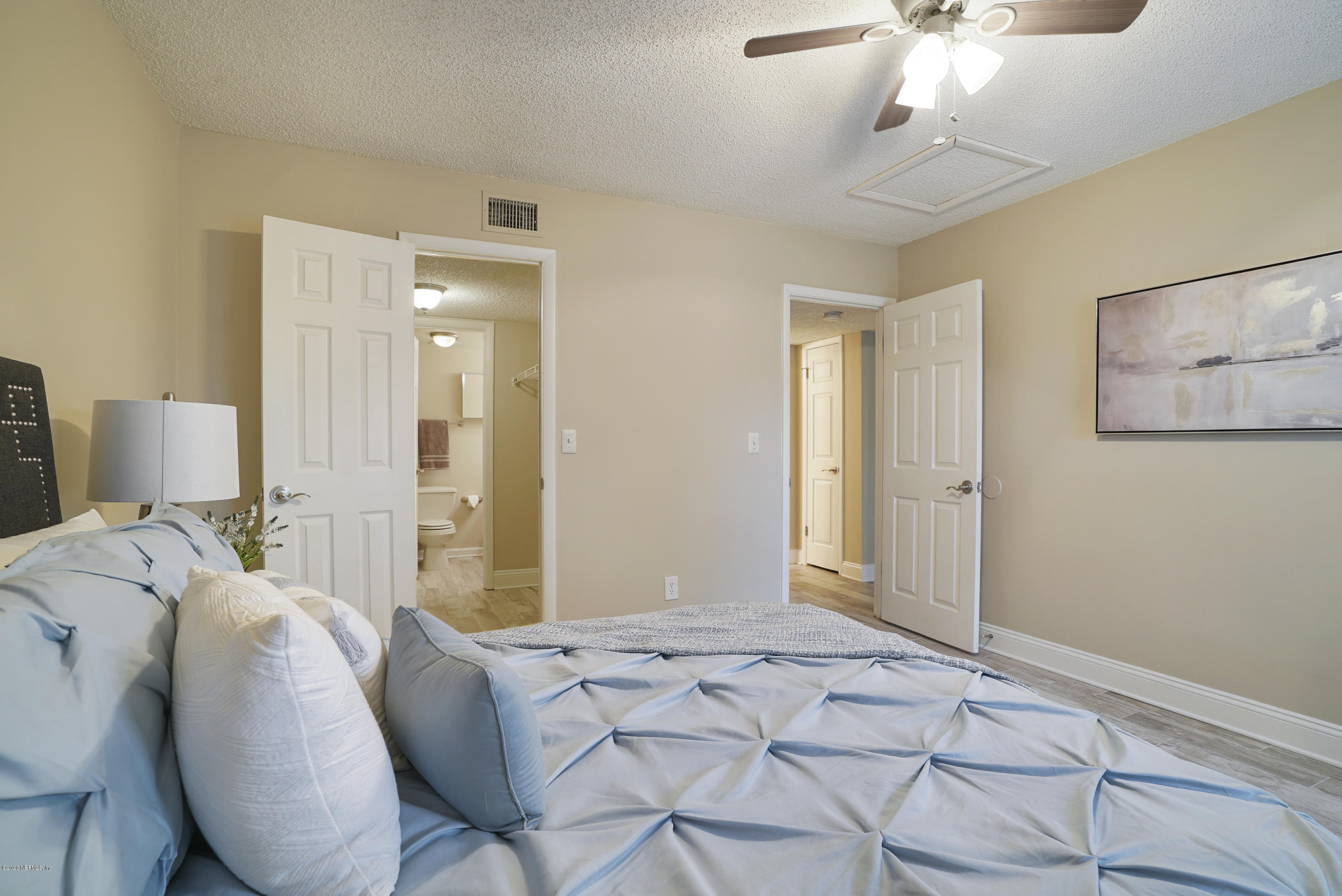 3737 Loretto Road, Unit 708 Jacksonville, FL 32223 - Photo 14 of 19 a bedroom with a bed and a chandelier