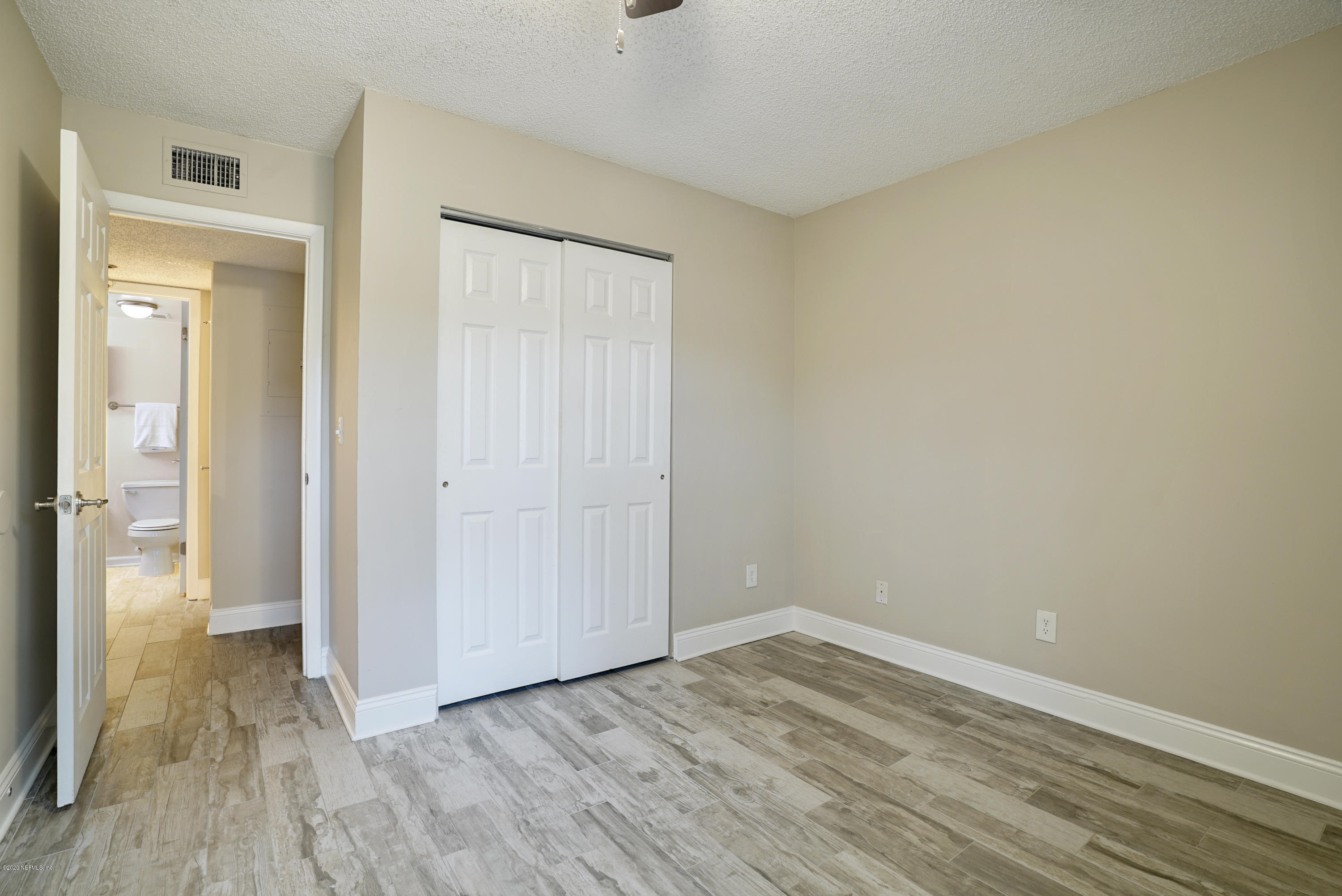 3737 Loretto Road, Unit 708 Jacksonville, FL 32223 - Photo 15 of 19 a view of an empty room and wooden floor