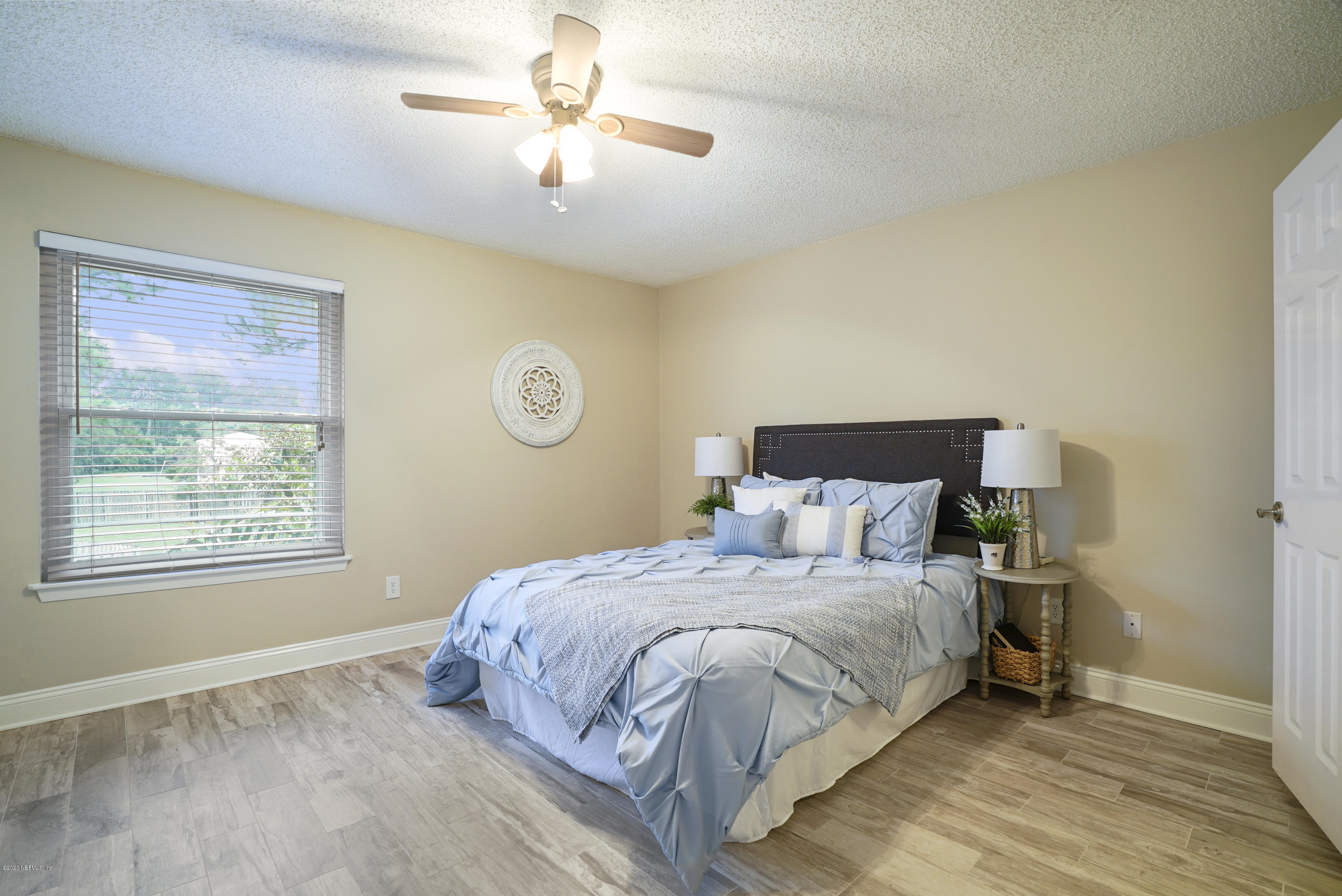 3737 Loretto Road, Unit 708 Jacksonville, FL 32223 - Photo 5 of 19 a bedroom with a large bed and a chandelier