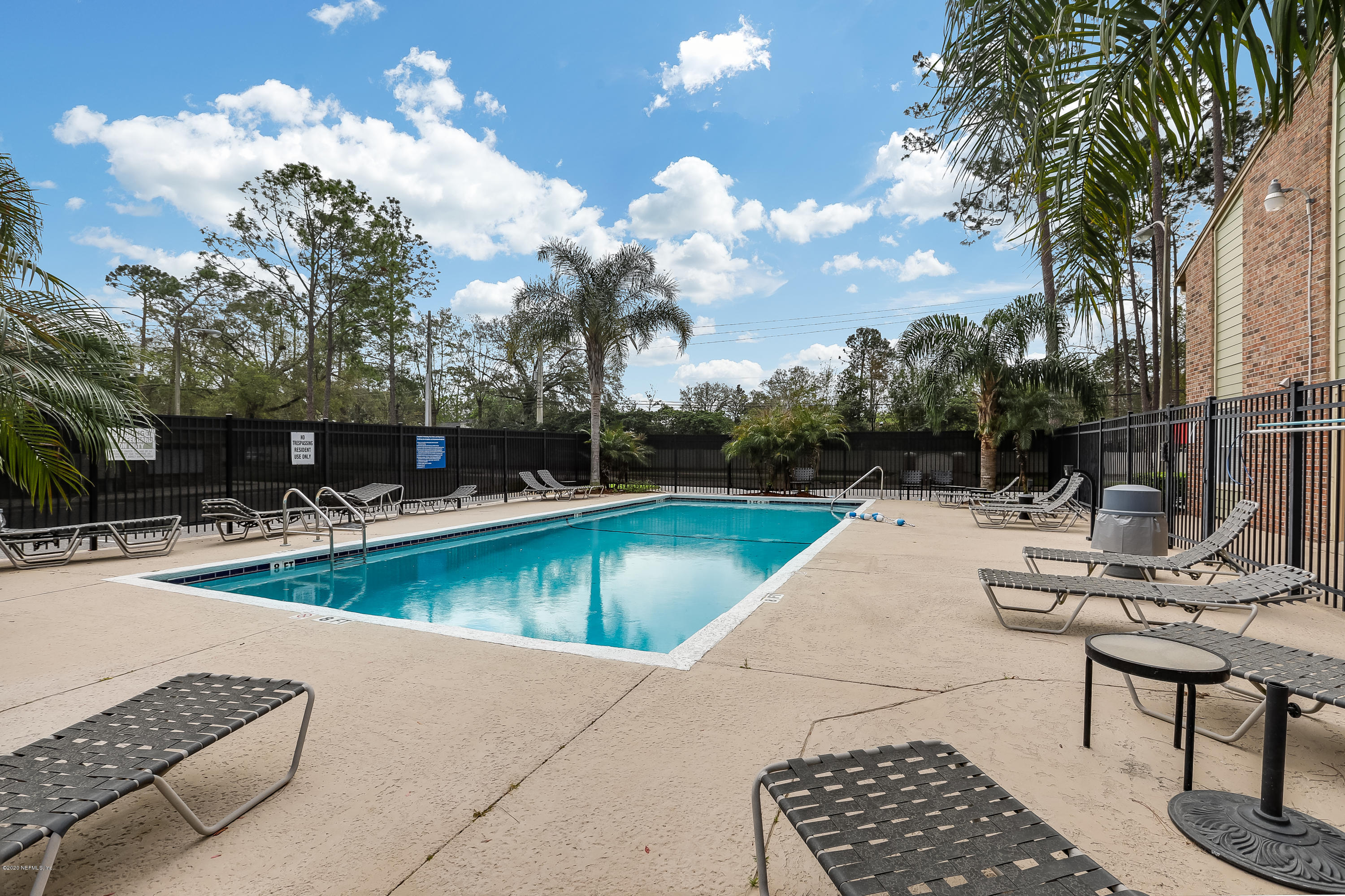 3737 Loretto Road, Unit 708 Jacksonville, FL 32223 - Photo 7 of 19 a view of a swimming pool with lounge chairs