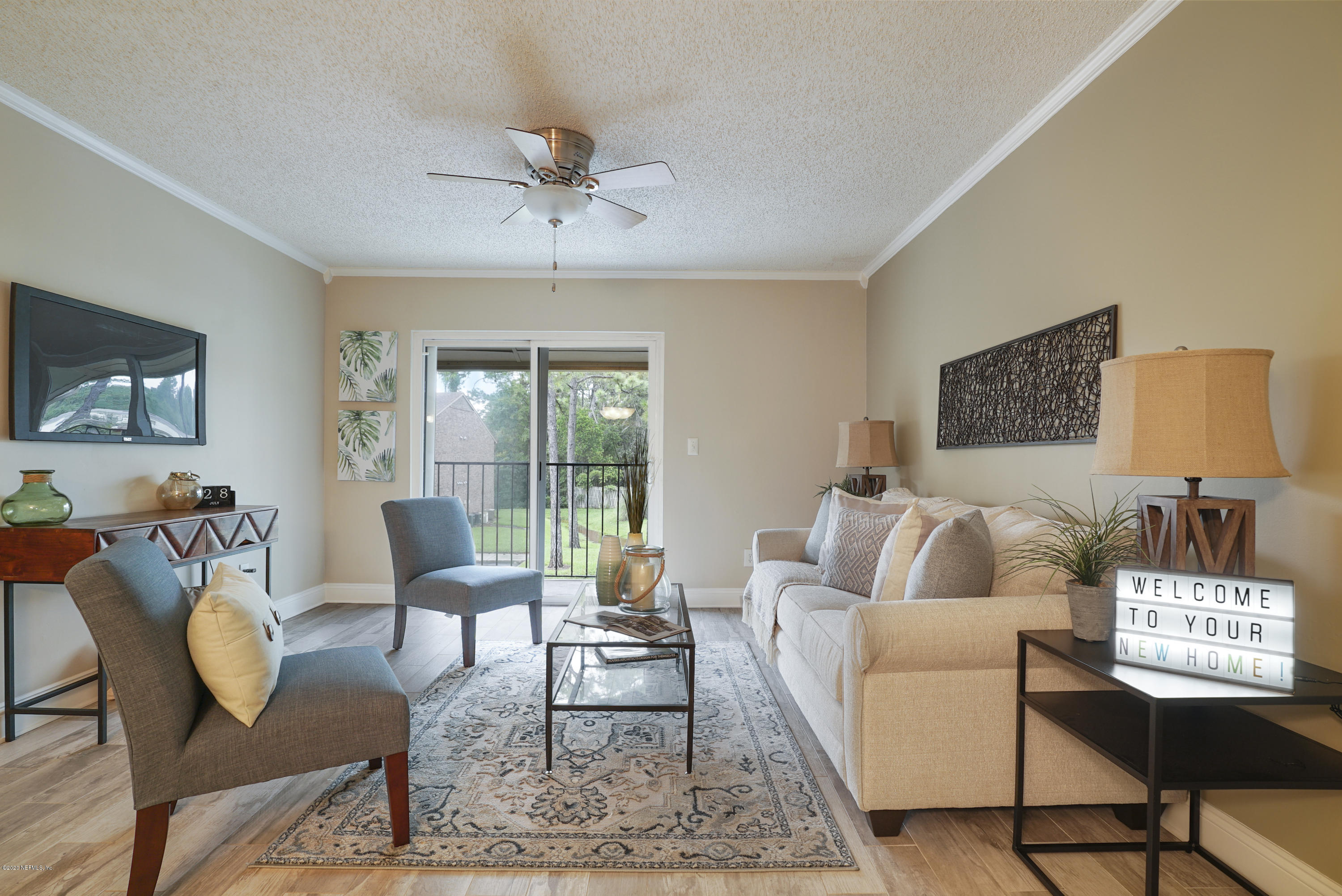 3737 Loretto Road, Unit 708 Jacksonville, FL 32223 - Photo 8 of 19 a living room with furniture and a window