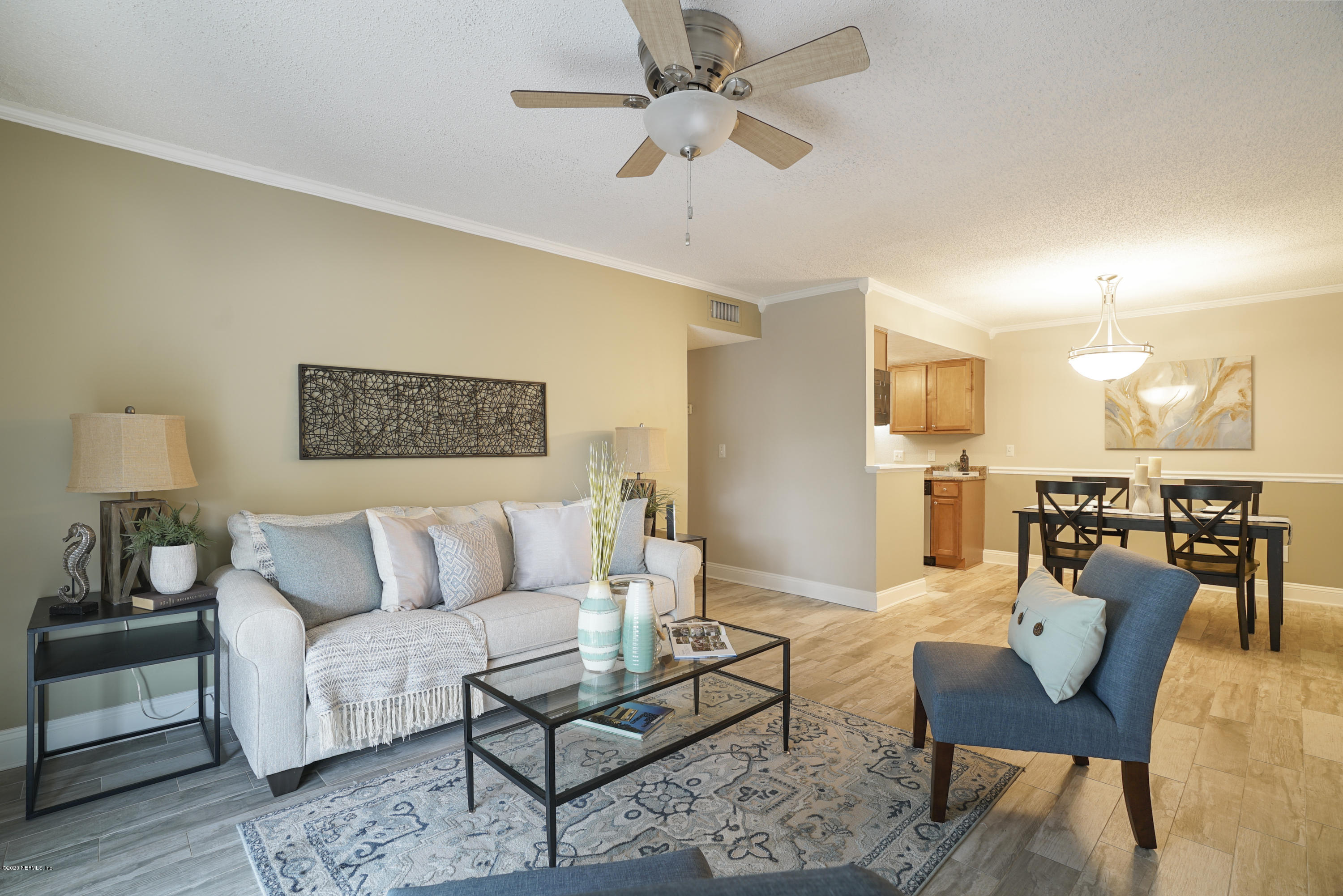 3737 Loretto Road, Unit 708 Jacksonville, FL 32223 - Photo 10 of 19 a living room with furniture and a table