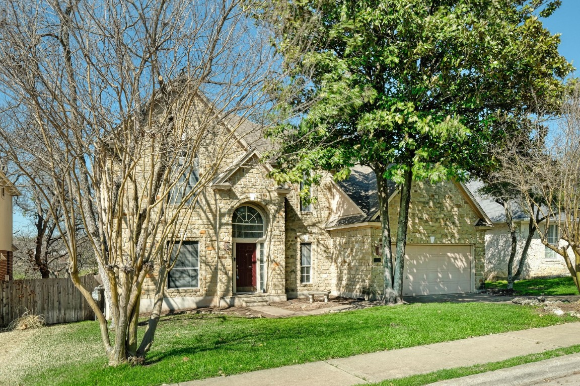 15610 Poynette Place Austin, TX 78717 - Photo 1 of 1 a front view of a house with garden