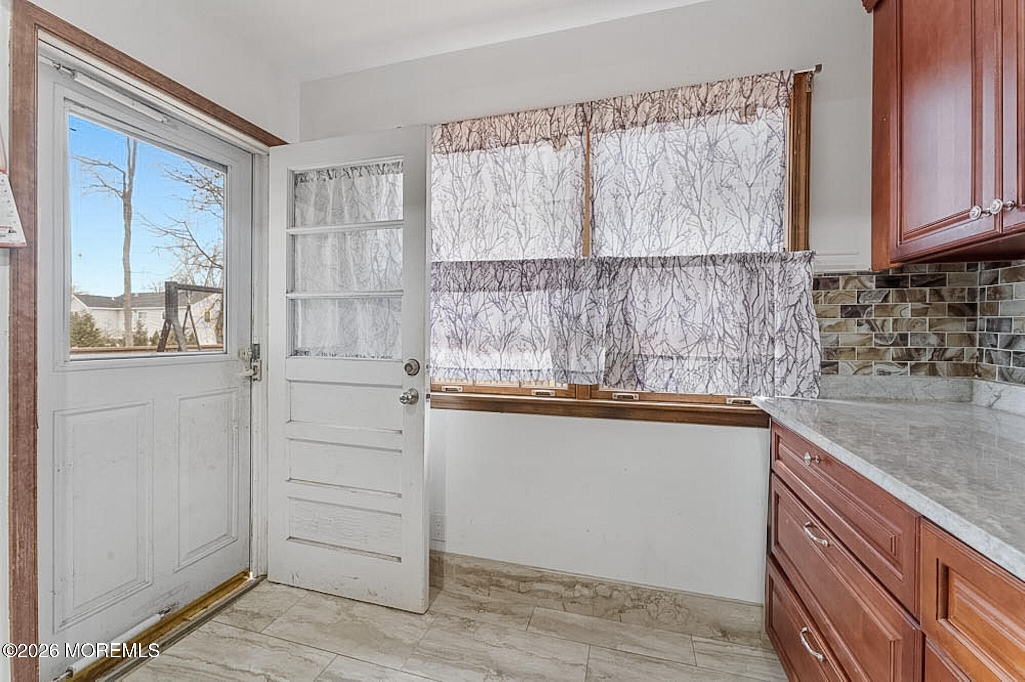 9 Neal Street Jackson, NJ 08527 - Photo 14 of 35 a kitchen with white cabinets and a window