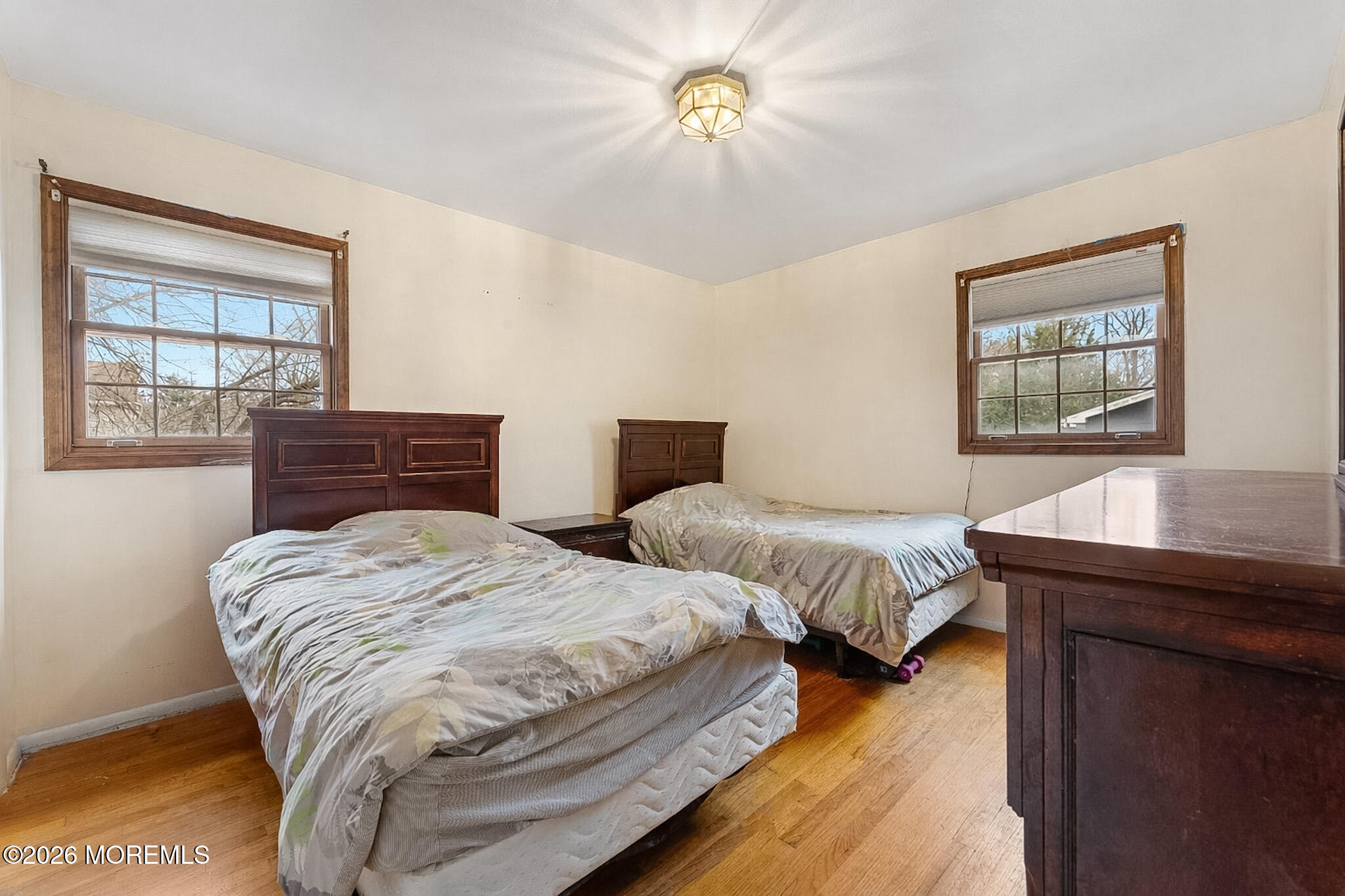 9 Neal Street Jackson, NJ 08527 - Photo 16 of 35 a bedroom with two beds and a chandelier