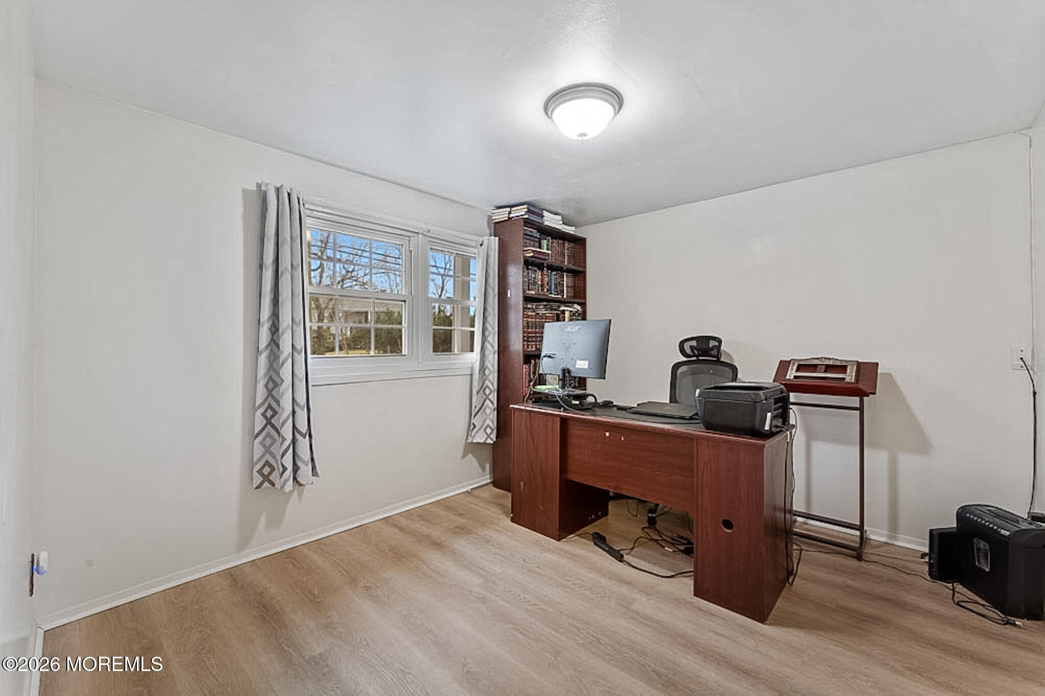 9 Neal Street Jackson, NJ 08527 - Photo 21 of 35 a view of a workspace with furniture and wooden floor