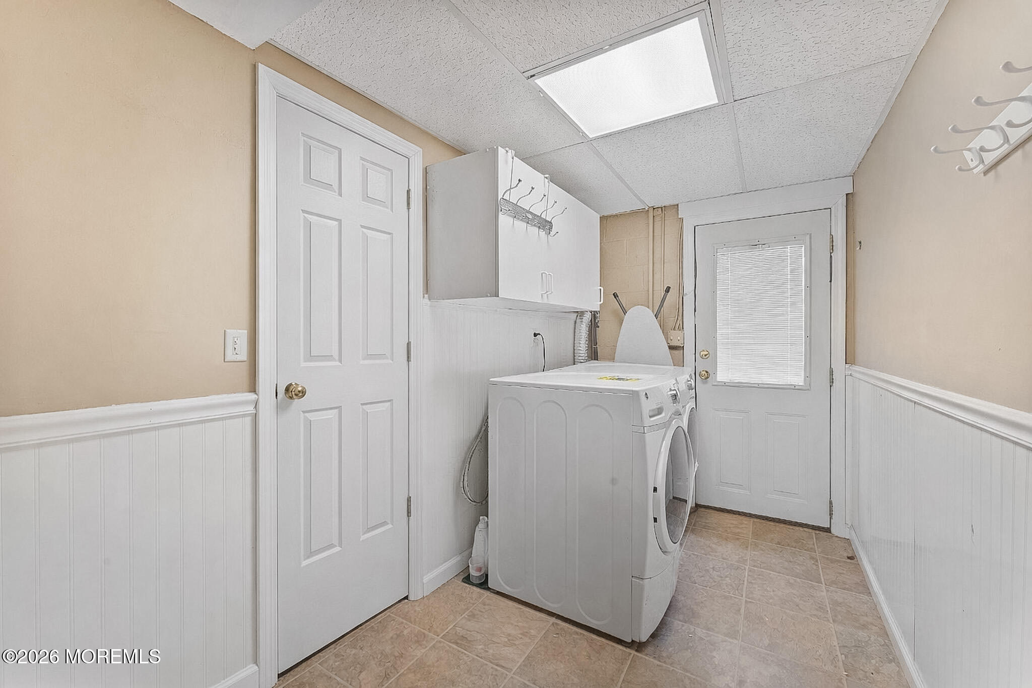 9 Neal Street Jackson, NJ 08527 - Photo 25 of 35 a utility room with cabinets washer and dryer