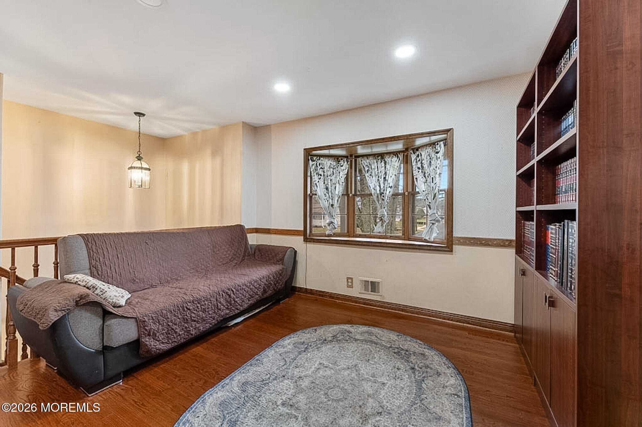9 Neal Street Jackson, NJ 08527 - Photo 5 of 35 a living room with a couch and a rug