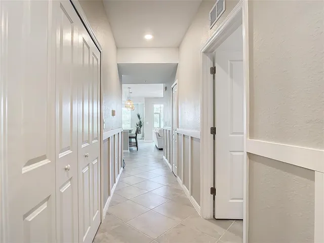 a view of kitchen with microwave and cabinets