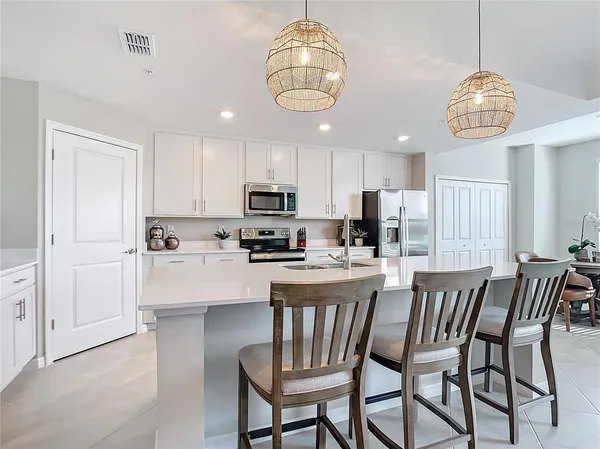 a kitchen with a sink and a refrigerator