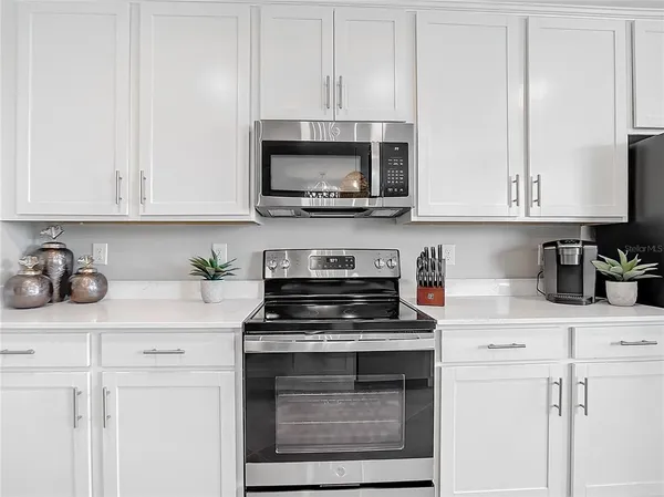 a view of a dining room with furniture and a window