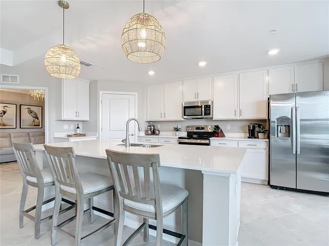 a living room with furniture cabinets and window