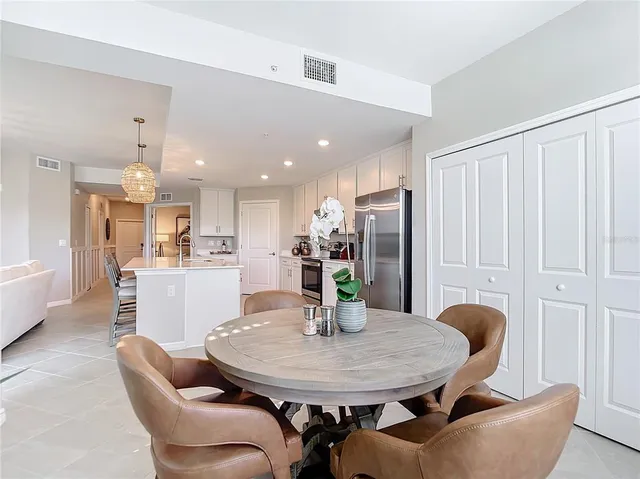 a living room with furniture a large window and a fireplace