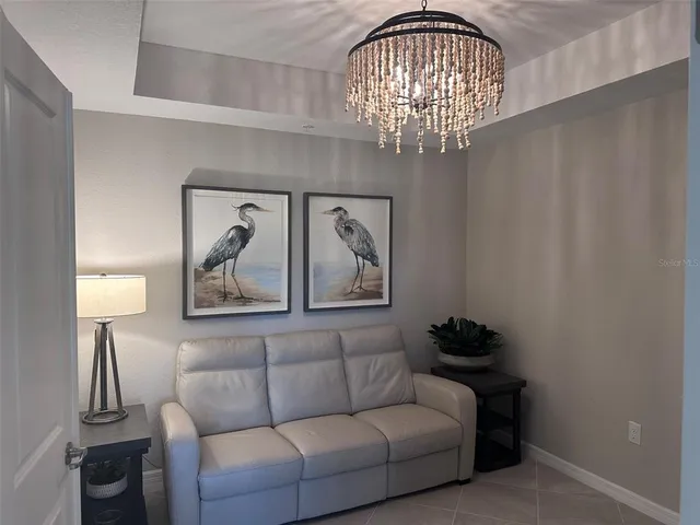 a bedroom with a bed and a night stand