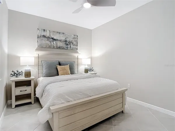 a bed room with a bed and a chair