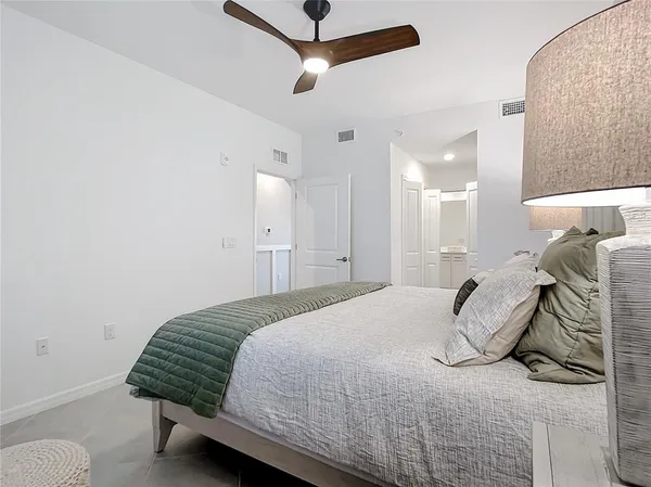 a bathroom with a shower sink and mirror
