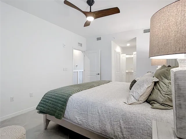 a bathroom with a shower sink and mirror