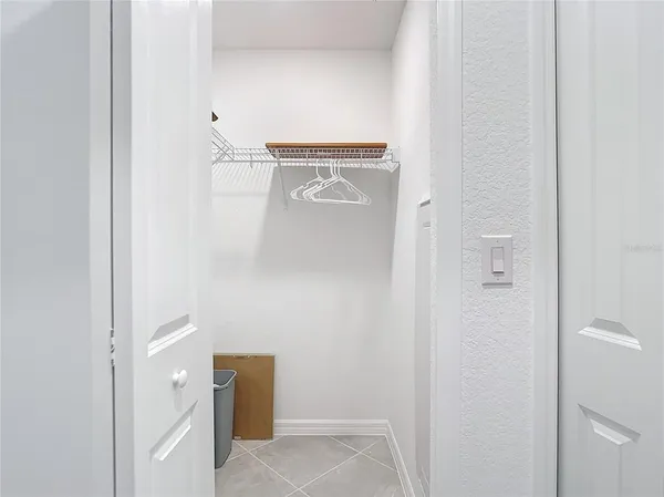 a spacious bathroom with a double vanity sink toilet and mirror