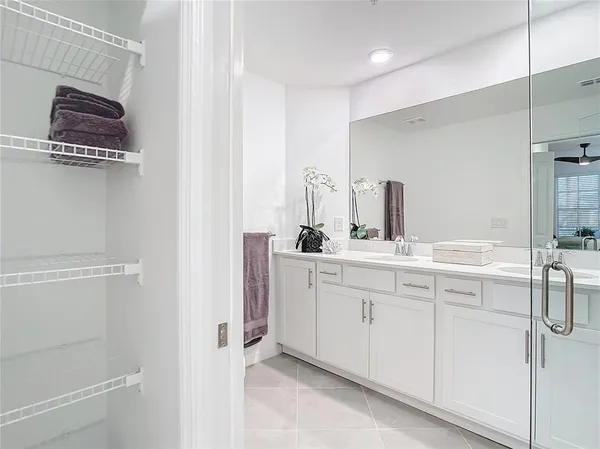 a bathroom with a toilet a sink a mirror and vanity