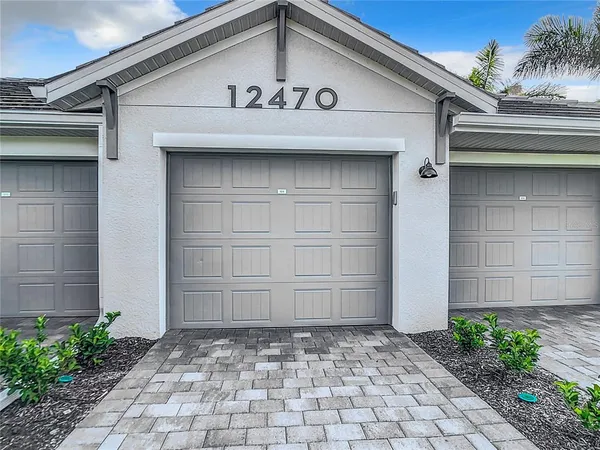 a view of a lake with houses in the back