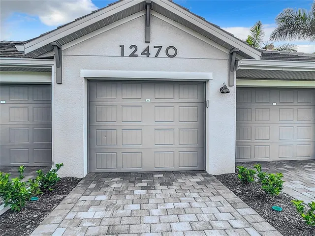 a view of a lake with houses in the back