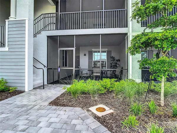 a view of a dining room that has a table and chairs in it