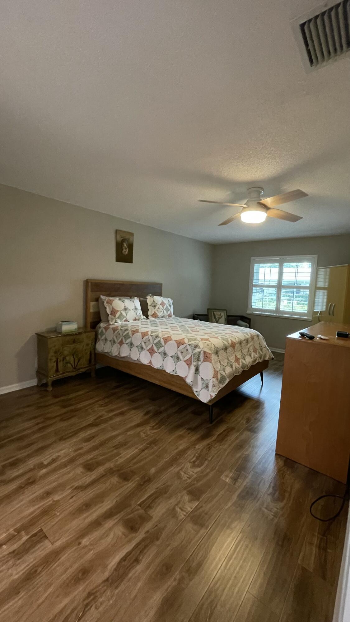 10140 South 44th Drive, Unit 372 Boynton Beach, FL 33436 - Photo 12 of 19 a bedroom with a bed and window