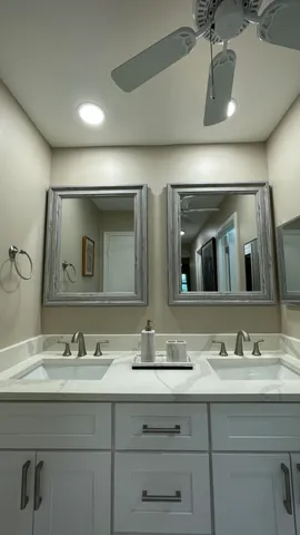 a bathroom with a toilet sink and shower