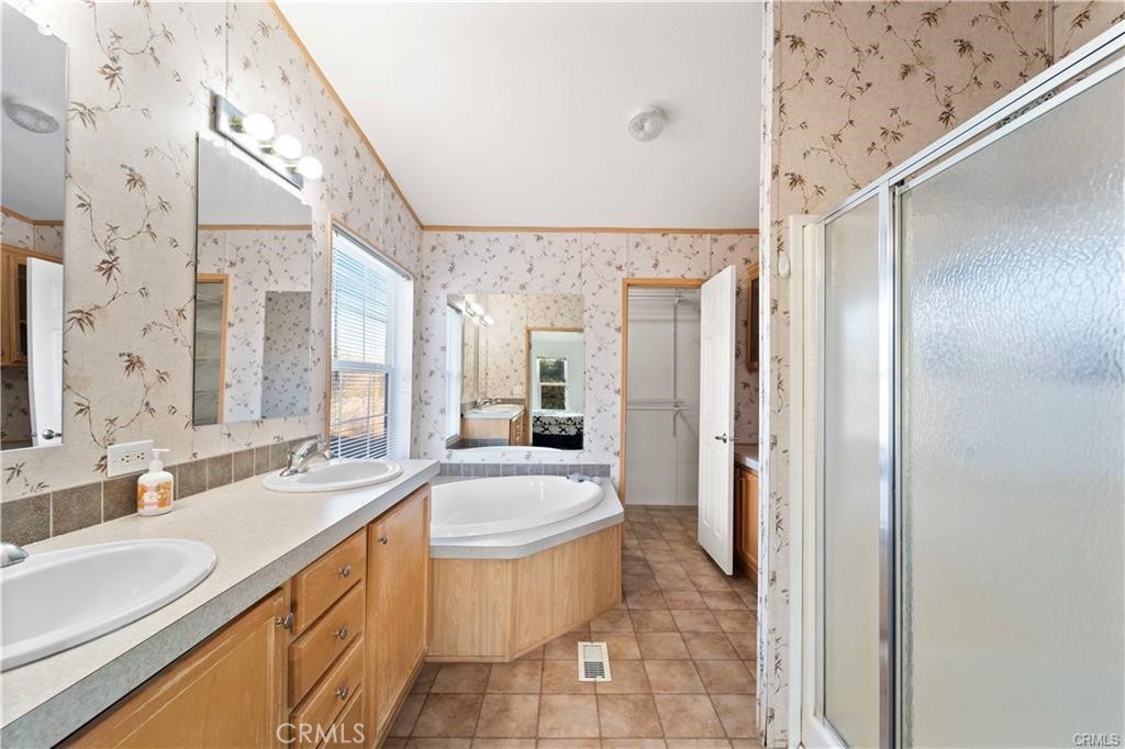 34232 Maui Road Newberry Springs, CA 92365 - Photo 15 of 35 a bathroom with a granite countertop sink toilet and shower