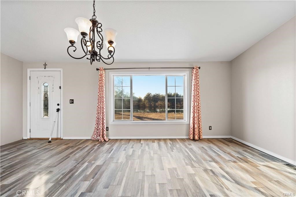 34232 Maui Road Newberry Springs, CA 92365 - Photo 16 of 35 a view of room with window and hardwood floor