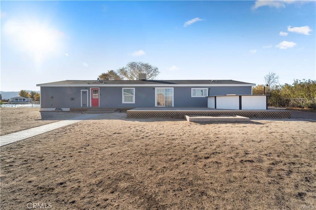 34232 Maui Road Newberry Springs, CA 92365 - Photo 5 of 35 a front view of a house with a yard