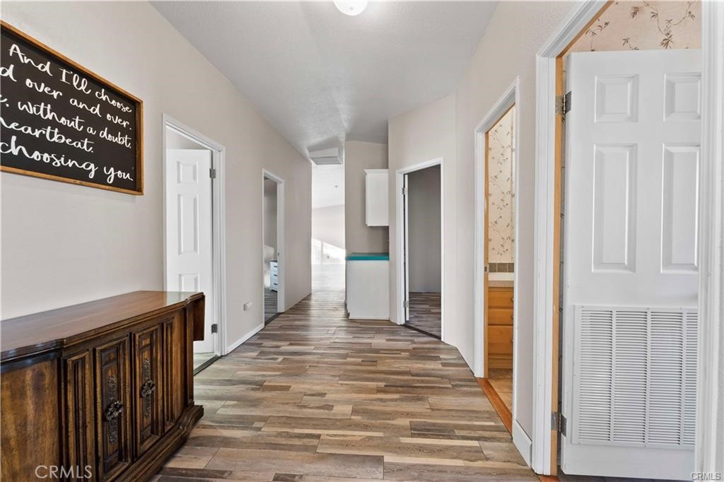 34232 Maui Road Newberry Springs, CA 92365 - Photo 9 of 35 a view of a hallway with wooden floor and entryway