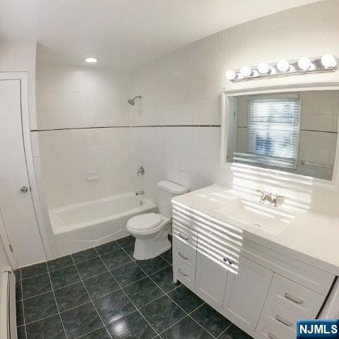 71 Gordon Street Ridgefield Park, NJ 07660 - Photo 12 of 20 a bathroom with a sink a toilet and bathtub