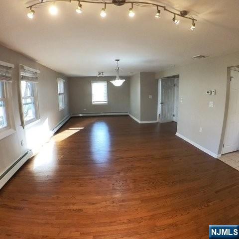 71 Gordon Street Ridgefield Park, NJ 07660 - Photo 3 of 20 an empty room with wooden floor and windows