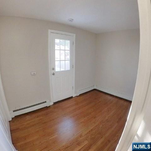 71 Gordon Street Ridgefield Park, NJ 07660 - Photo 7 of 20 an empty room with wooden floor and windows