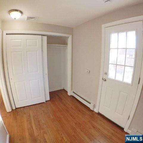 71 Gordon Street Ridgefield Park, NJ 07660 - Photo 8 of 20 an empty room with wooden floor and windows