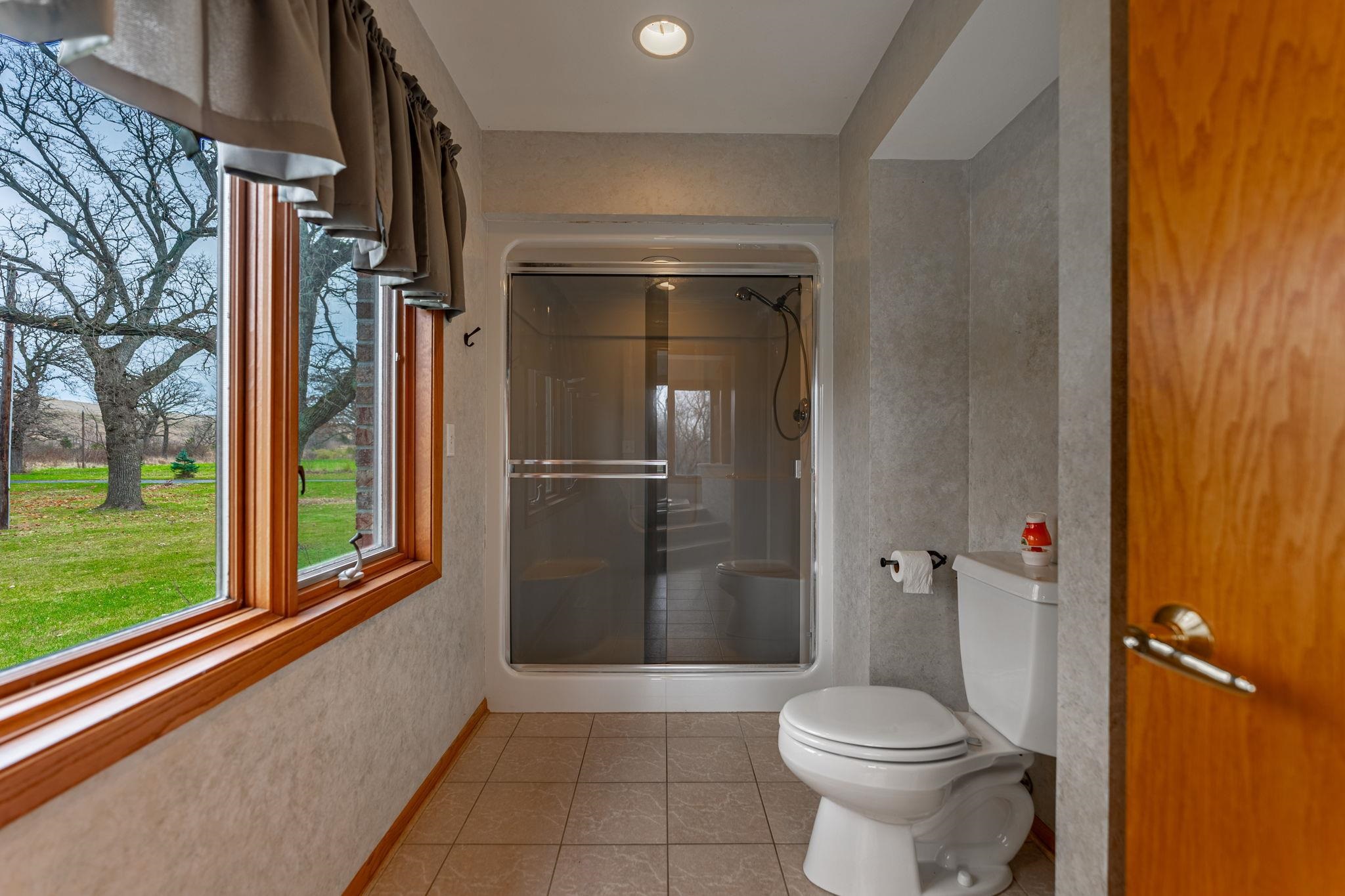 8634 North Kilbuck Road Monroe Center, IL 61052 - Photo 25 of 50 a bathroom with a toilet and a shower