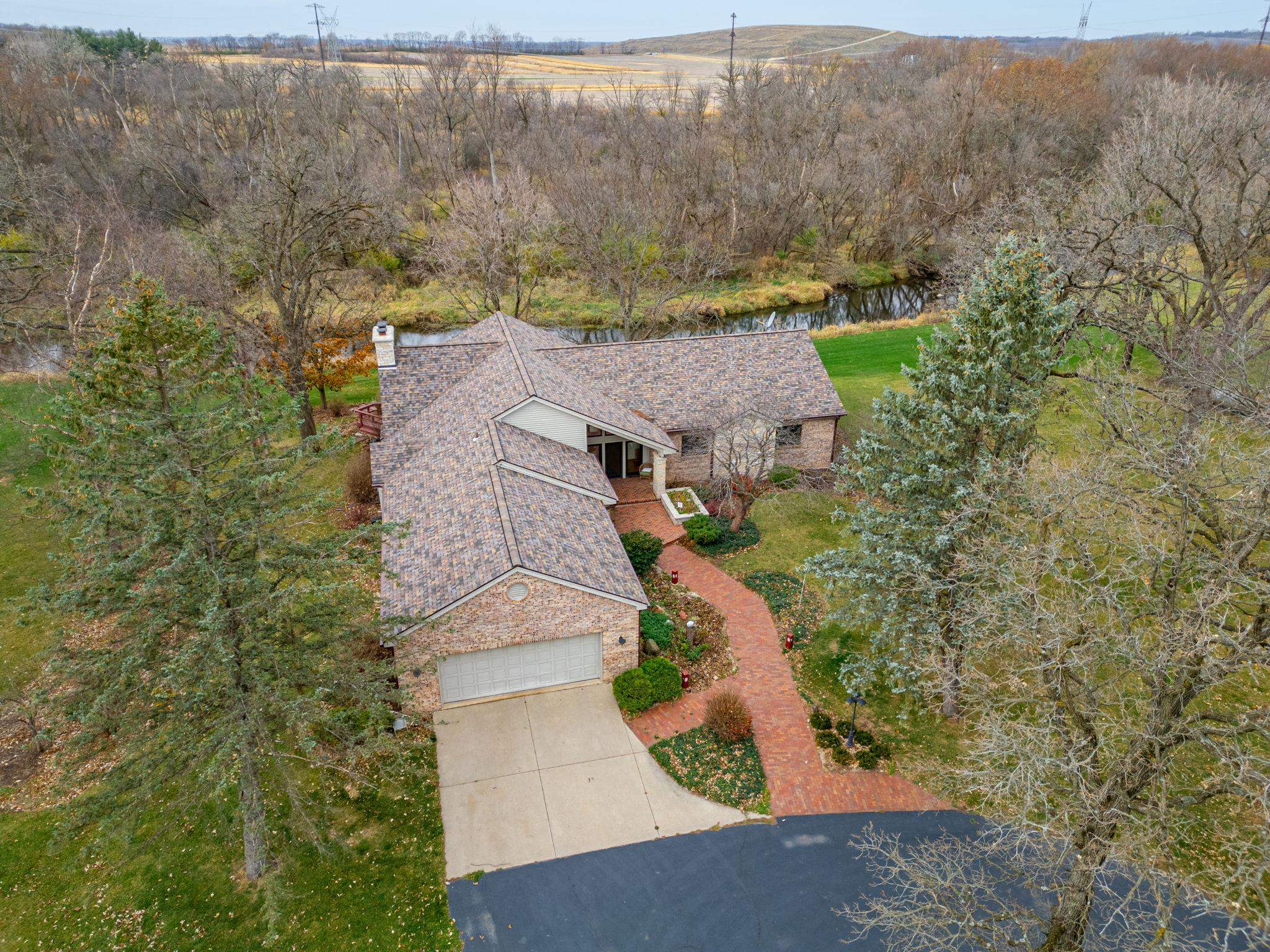 8634 North Kilbuck Road Monroe Center, IL 61052 - Photo 3 of 50 an aerial view of a house with a yard and large tree