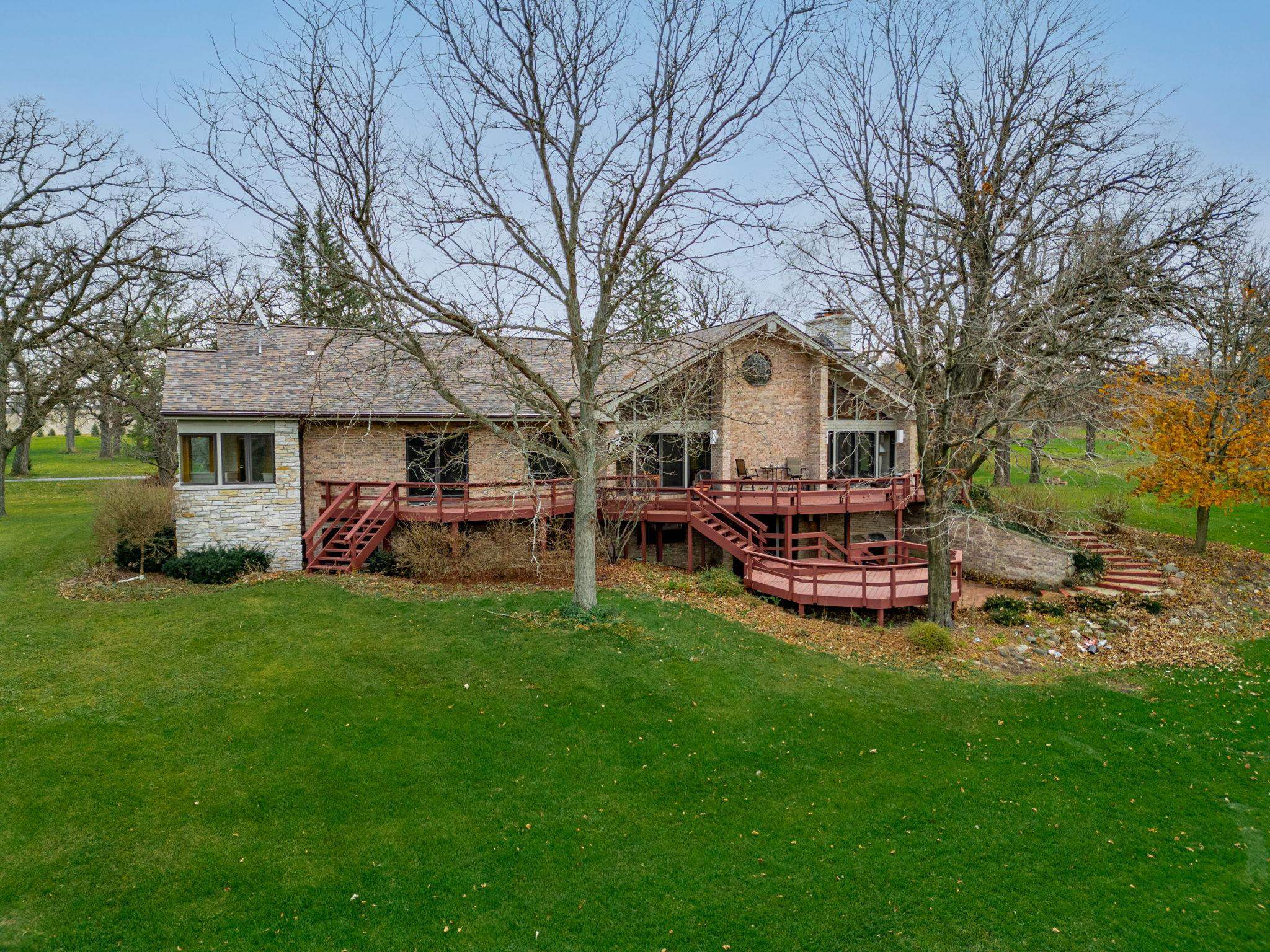 8634 North Kilbuck Road Monroe Center, IL 61052 - Photo 44 of 50 a front view of a house with garden and trees