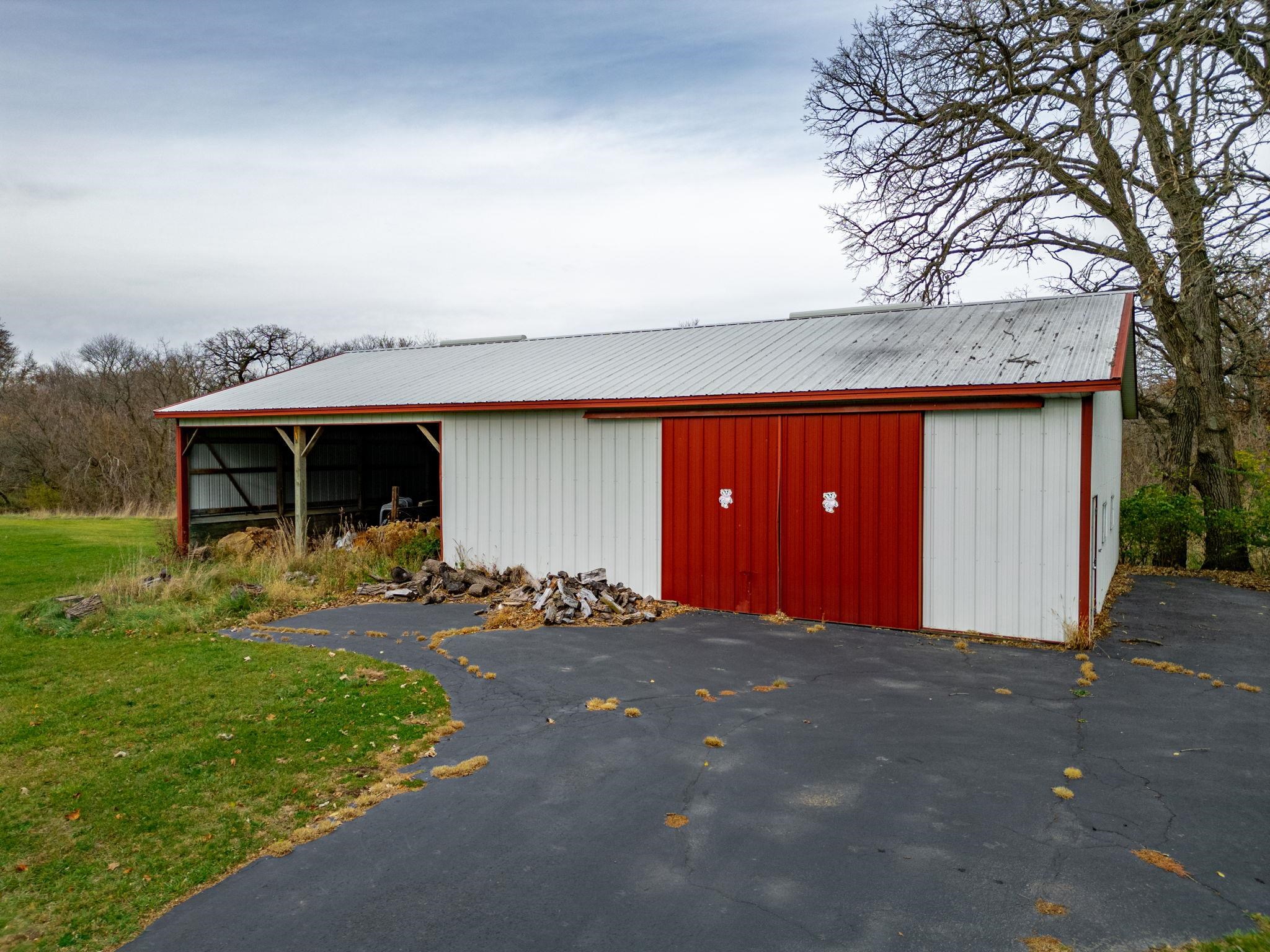 8634 North Kilbuck Road Monroe Center, IL 61052 - Photo 48 of 50 a front view of a house with a yard