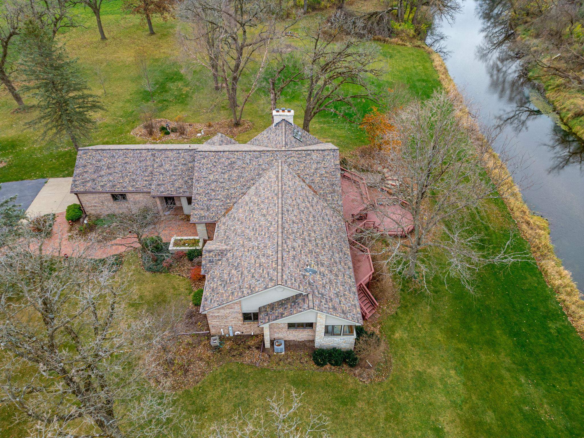 8634 North Kilbuck Road Monroe Center, IL 61052 - Photo 50 of 50 an aerial view of a house with a yard