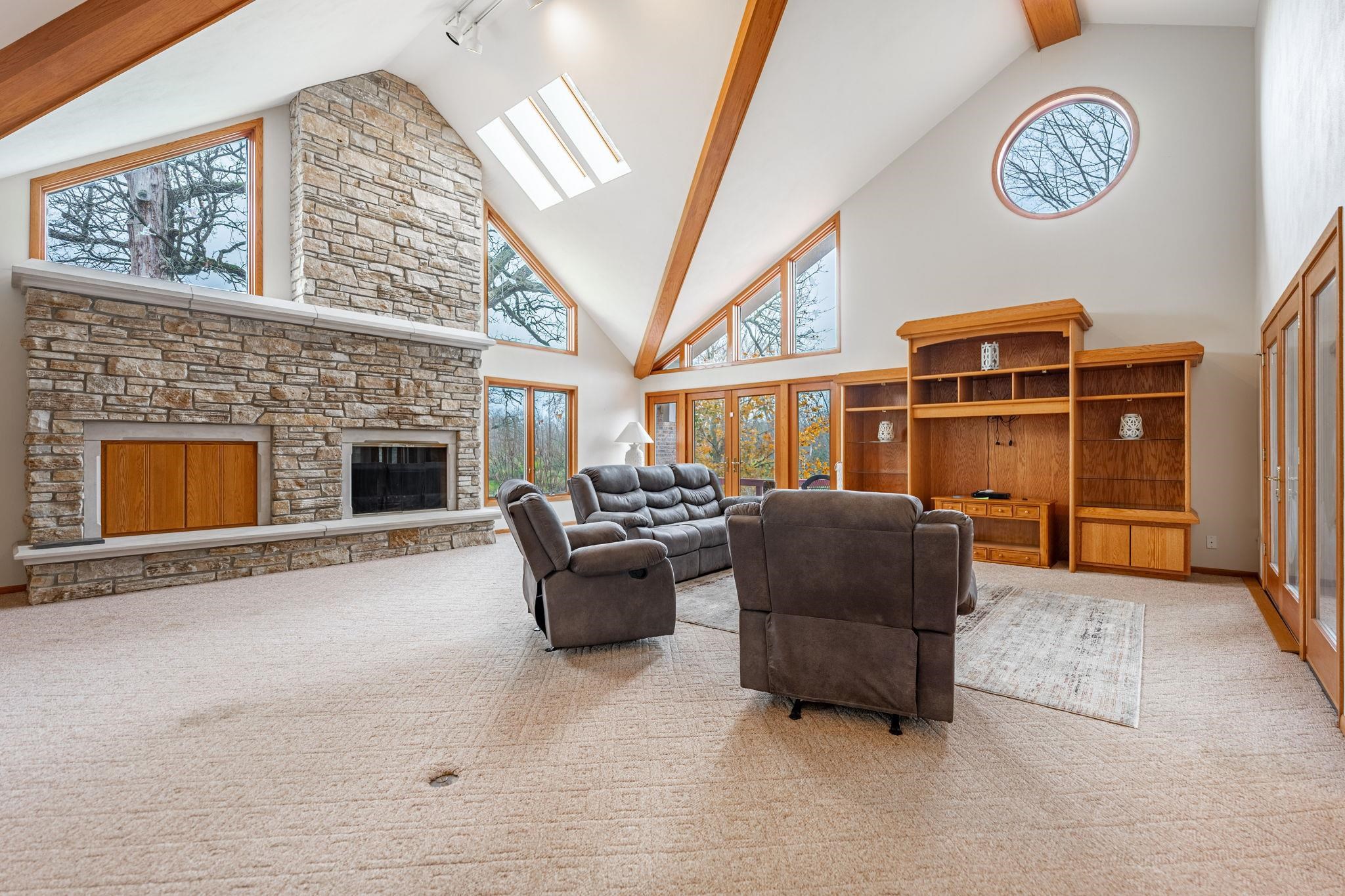 8634 North Kilbuck Road Monroe Center, IL 61052 - Photo 8 of 50 a living room with furniture and a fireplace