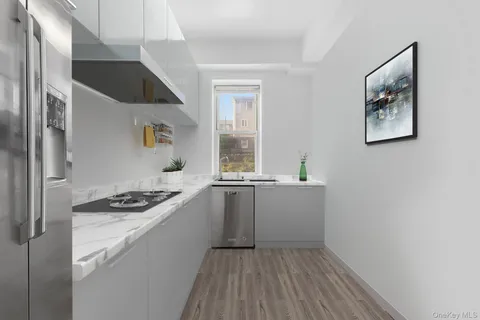 a kitchen with a sink cabinets and window