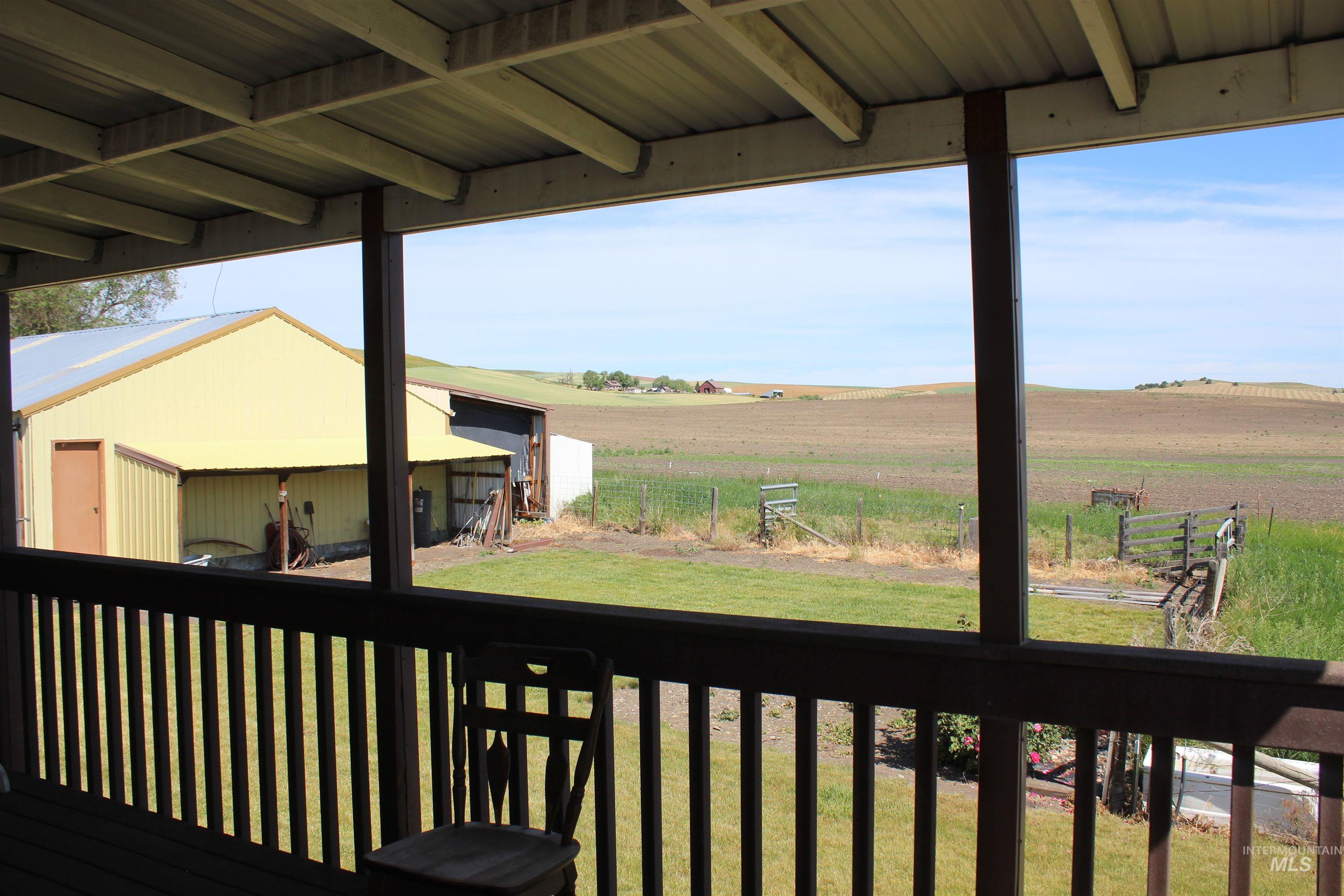 1034 Greencreek Road Greencreek, ID 83533 - Photo 16 of 42 Wooden terrace with a rural view and an outbuilding