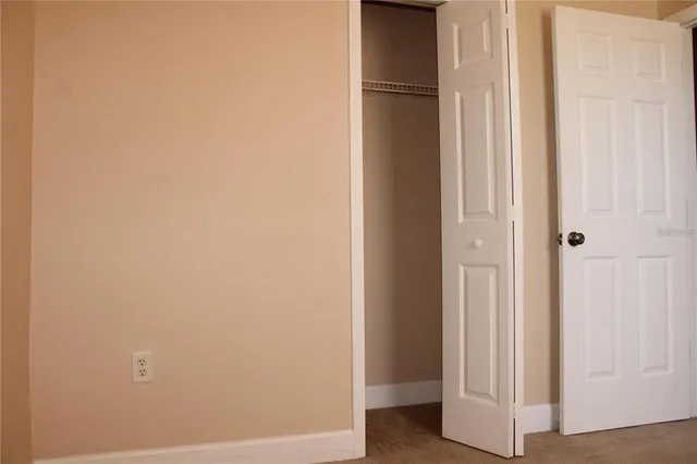 a view of a hallway with closet