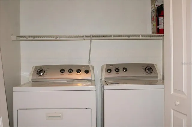 a utility room with dryer and washer