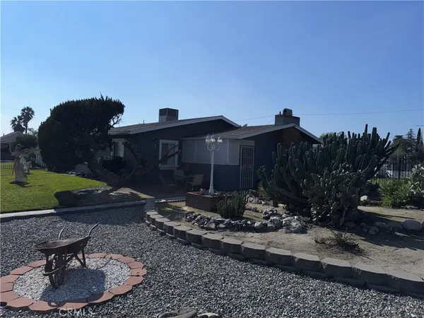 a view of a house with a yard and a sink