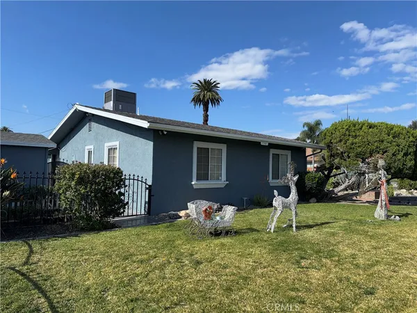 a house view with a garden space